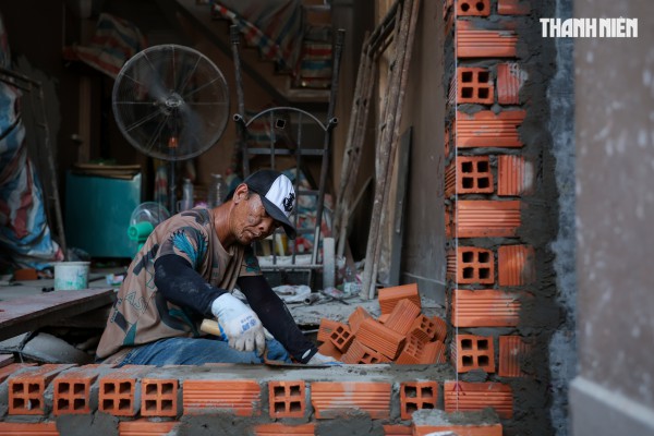 Người dân TP.HCM dỡ nhà, nhường đất mở rộng quốc lộ 13 Người dân TP.HCM dỡ nhà, nhường đất mở rộng quốc lộ 13